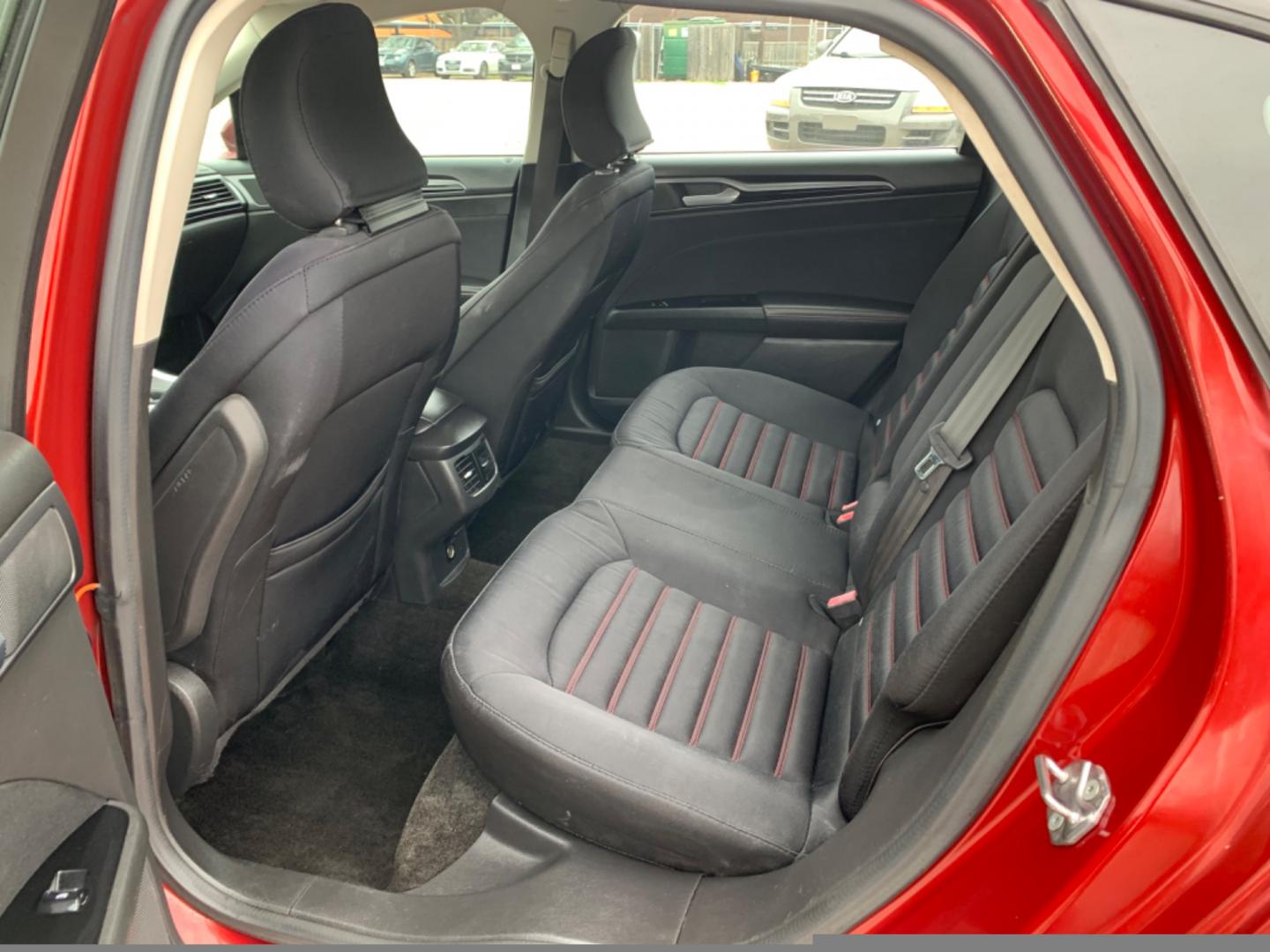2015 Maroon /Black Ford Fusion SE (3FA6P0H95FR) with an 2.0L L4 DOHC 16V engine, Automatic transmission, located at 1830 North Belt Line Road, Irving, TX, 75061, (469) 524-0199, 32.834373, -96.993584 - Photo#7